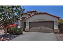 Charming home featuring a two-car garage, desert landscaping, and a well-maintained front yard at 3812 W Carlos Ln, San Tan Valley, AZ 85144