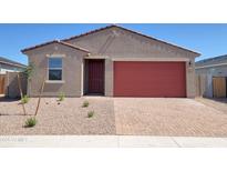 Charming single-story home with a red garage door and a low maintenance desert landscape at 4256 W Lisa Ln, San Tan Valley, AZ 85144