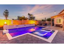 Inviting pool with water features and lounge chairs is perfect for relaxation and entertainment at 4446 W Kimberly Way, Glendale, AZ 85308