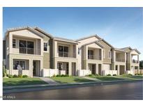 New townhomes with landscaped front yards and white picket fences at 8149 E Petunia Ave # 1007, Mesa, AZ 85212