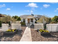Charming single-story home featuring a well-manicured front yard and a welcoming walkway to the front door at 905 E Coronado Rd, Phoenix, AZ 85006