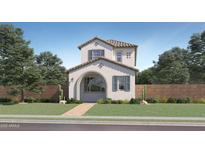 Charming two-story home featuring a covered entry, symmetrical windows, a tiled roof, and a low-maintenance yard at 9735 W Catalina Dr, Phoenix, AZ 85037