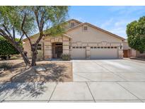 Charming single-story home featuring a three-car garage and well-maintained desert landscaping at 1029 E Ian Dr, Phoenix, AZ 85042