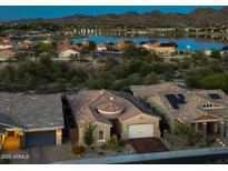 Beautiful single-Gathering home with lake view and lush desert landscaping at 10507 S 181St Ave, Goodyear, AZ 85338