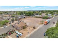 Aerial view of a spacious lot ready for development, surrounded by established neighborhood homes and local vegetation at 1137 E 5Th Ave, Mesa, AZ 85204