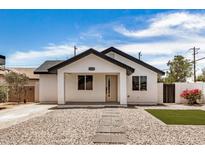 Charming single-story home featuring modern design, xeriscape, and vibrant bougainvillea at 1501 E Sheridan St, Phoenix, AZ 85006