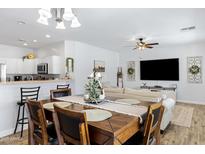 Open concept dining area with view into living room and modern decor at 17292 W Pinnacle Vista Dr, Surprise, AZ 85387
