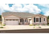 Charming single-story home with a two-car garage and a well-manicured front yard at 20534 S 216Th Pl, Queen Creek, AZ 85142
