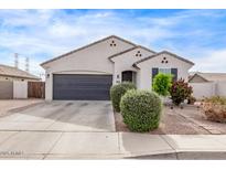Charming single-story home with a desert landscape, complete with a two-car garage and ample parking space at 2614 S 120Th Ave, Avondale, AZ 85323