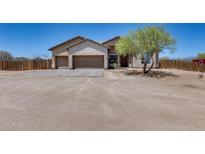 Expansive desert home with three-car garage, stone accents, desert landscaping, and ample parking at 30511 N 162Nd Way, Scottsdale, AZ 85262