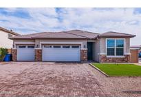 Charming single-story home showcasing a three-car garage and a meticulously paved driveway for added curb appeal at 3623 S 78Th Dr, Phoenix, AZ 85043