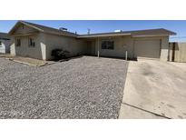 Charming single-story home with a low-maintenance gravel front yard and attached garage at 3814 N 55Th Dr, Phoenix, AZ 85031