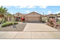 Charming single-Gathering home featuring desert landscaping, a two-car garage and lovely curb appeal at 15534 W Big Sky Dr, Surprise, AZ 85374