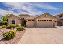 Inviting single-Gathering home featuring a three-car garage and well-maintained front yard at 1555 E Monterey St, Chandler, AZ 85225