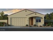 Charming single-story home with a two-car garage and well-manicured landscaping at 17633 W Georgia Ave, Litchfield Park, AZ 85340