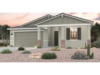 Charming single-story home with desert landscaping, a two car garage and a welcoming front porch at 18066 W Creedance Blvd, Surprise, AZ 85387