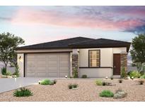 Charming single-story home featuring desert landscaping, stone accents, and a two-car garage at 22824 N 182Nd Ln, Surprise, AZ 85387
