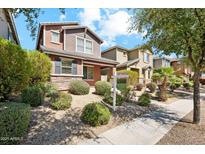 Charming two-story home featuring desert landscaping, a sidewalk, and a welcoming front yard at 4380 E Renee Dr, Phoenix, AZ 85050