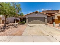 Charming single-story home with a two-car garage and low-maintenance desert landscaping at 5526 W Ellis Dr, Laveen, AZ 85339