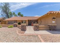 Charming single-story home featuring a desert landscape, a walkway, and a lovely desert style color scheme at 6073 E Beck Ln, Scottsdale, AZ 85254