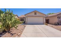Charming single-story home featuring a two-car garage and desert landscaping at 645 W Kingman Loop, Casa Grande, AZ 85122