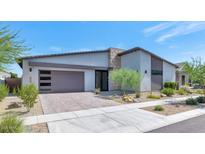 Beautiful single-story home featuring a modern design, desert landscaping, and a two-car garage at 812 E Summerside Rd, Phoenix, AZ 85042