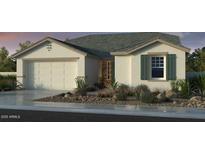 Charming single-story home showcasing a desert landscaped front yard and a two car garage at 10201 W Weldon Ave, Avondale, AZ 85392