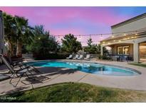 Inviting pool with lounge chairs and beautiful sunset lighting, perfect for relaxing evenings at 21266 S 213Th Pl, Queen Creek, AZ 85142