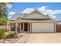 Charming single-Gathering home featuring a well-manicured lawn, solar panels, and a two-car garage at 2508 N Karen Dr, Chandler, AZ 85224