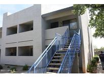 Apartment building exterior with blue stairs leading to the second floor entrance at 3301 E Earll Dr # 219, Phoenix, AZ 85018