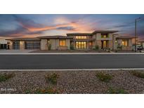 Striking modern home featuring desert landscaping and a large garage at 24138 S 220Th St, Queen Creek, AZ 85142