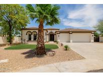 Charming home with well-manicured front yard, desert landscaping and spacious three car garage at 2994 E Mahogany Pl, Chandler, AZ 85249