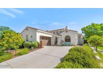 Charming single-story home featuring a manicured front yard and a two-car garage at 3521 N Hooper St, Buckeye, AZ 85396