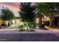Charming stone home with manicured landscaping and warm exterior lighting at 4519 N 29Th Way, Phoenix, AZ 85016