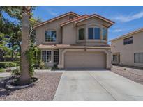 Charming two-story home with a two-car garage and well-maintained landscaping at 533 N Cobblestone St, Gilbert, AZ 85234