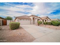 Charming home featuring a tile roof, neutral stucco, and a spacious two-car garage at 636 E Redondo Dr, Gilbert, AZ 85296