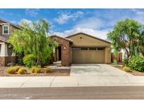 Charming single-story home featuring a desert landscape and a convenient two-car garage at 9222 W Roma Ave, Phoenix, AZ 85037