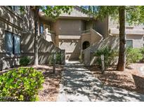 Inviting condo exterior featuring well-maintained landscaping and private entrances at 15252 N 100Th St # 1147, Scottsdale, AZ 85260