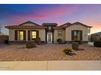 Charming single-story home with well-maintained landscaping and a welcoming entrance at 18577 W Coolidge St, Goodyear, AZ 85395