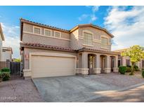 Charming two-story home featuring a neutral color palette and well-manicured landscaping at 2652 E Riviera Dr, Chandler, AZ 85249
