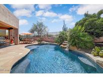 Sparkling backyard pool with desert landscaping and seating area with mountain views at 27892 N 108Th Way, Scottsdale, AZ 85262