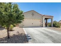 Charming single-story home featuring a well-maintained front yard and neutral-colored exterior at 4080 N 309Th Cir, Buckeye, AZ 85396