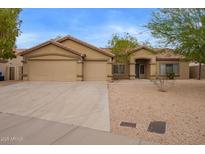 Charming single-story home featuring a three car garage and low-maintenance desert landscaping at 7019 S 19Th Pl, Phoenix, AZ 85042