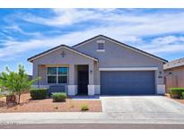 Charming single-story home featuring a well-maintained front yard and a two-car garage at 7751 W Miami St, Phoenix, AZ 85043