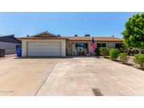 Charming single-story home with a well-maintained front yard and a two-car garage at 13614 N 33Rd Ave, Phoenix, AZ 85029