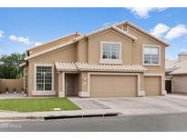 Charming two-story home featuring a tile roof and a three-car garage at 3126 W Stephens Pl, Chandler, AZ 85226