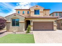 Inviting two-story home featuring a two-car garage, manicured lawn, and well-maintained front yard at 5407 S Tatum Ln, Gilbert, AZ 85298