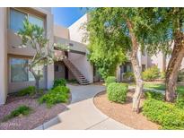 Inviting exterior view of the apartment complex featuring landscaped grounds and well-maintained pathways at 11260 N 92Nd St # 2111, Scottsdale, AZ 85260