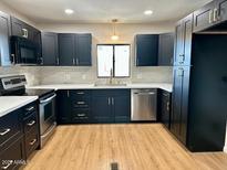Updated kitchen featuring new appliances and modern cabinetry with beautiful quartz countertops at 1149 S 98Th St, Mesa, AZ 85208