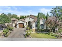 Charming single-story home with meticulously landscaped front yard and paver driveway at 211 W New Dawn Dr, Chandler, AZ 85248